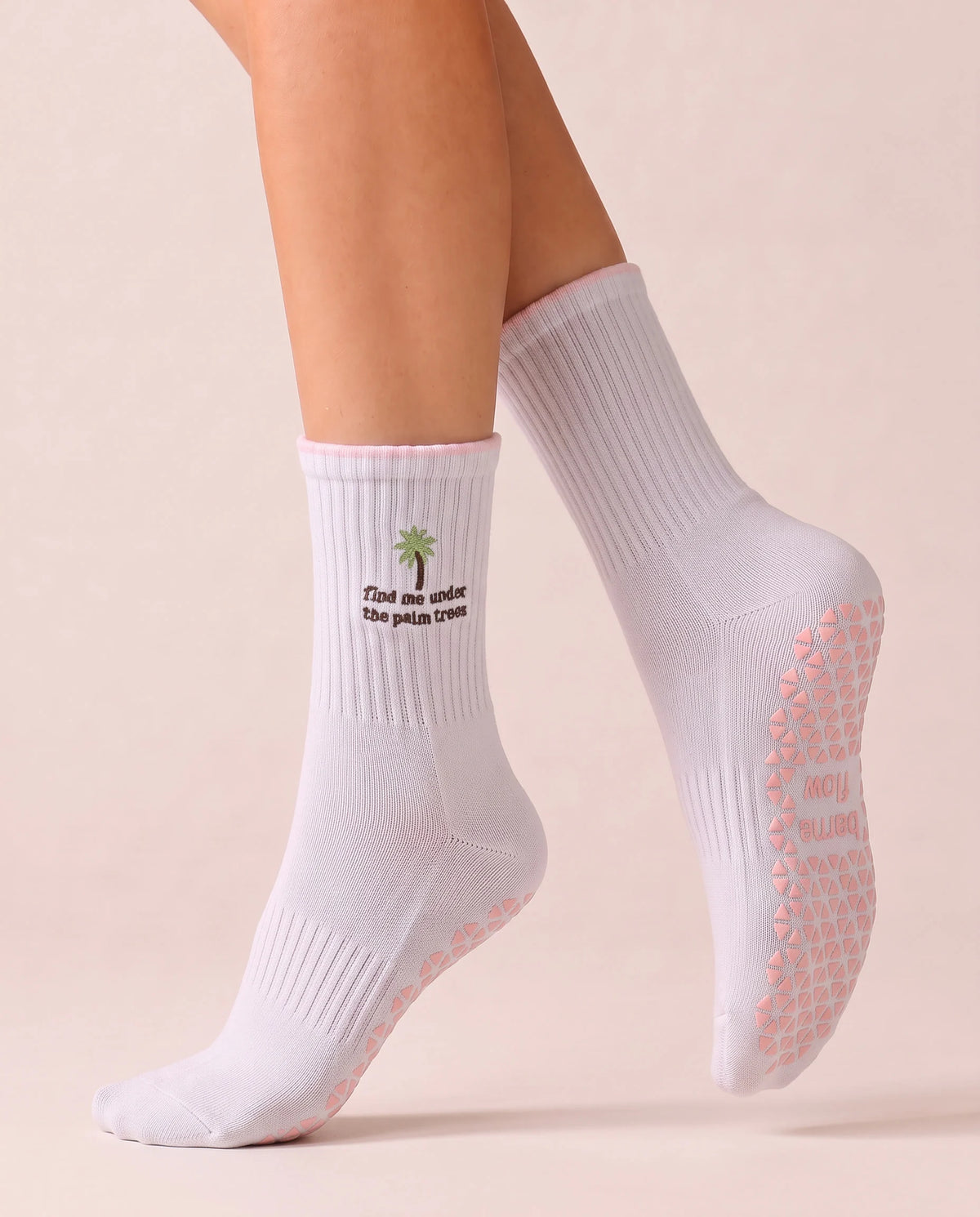 Barcelona Palm Pilates Grip Socks mid-step, showing the blush-pink floor grip